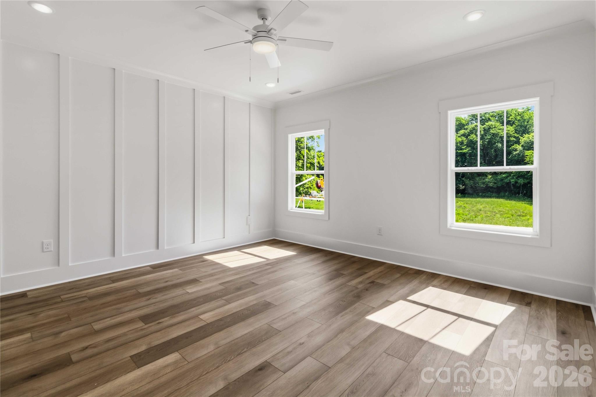 352 Adams Road Clover, SC 29710 - Photo 18 of 38 a view of an empty room with a window and wooden floor