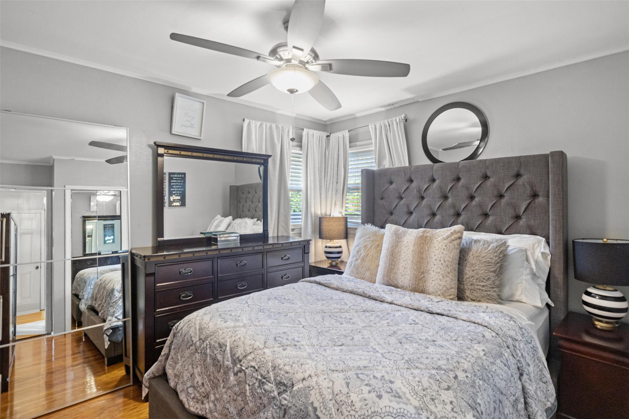 239-15 147th Road Queens, NY 11422 - Photo 10 of 28 Bedroom featuring crown molding, light wood-type flooring, and ceiling fan