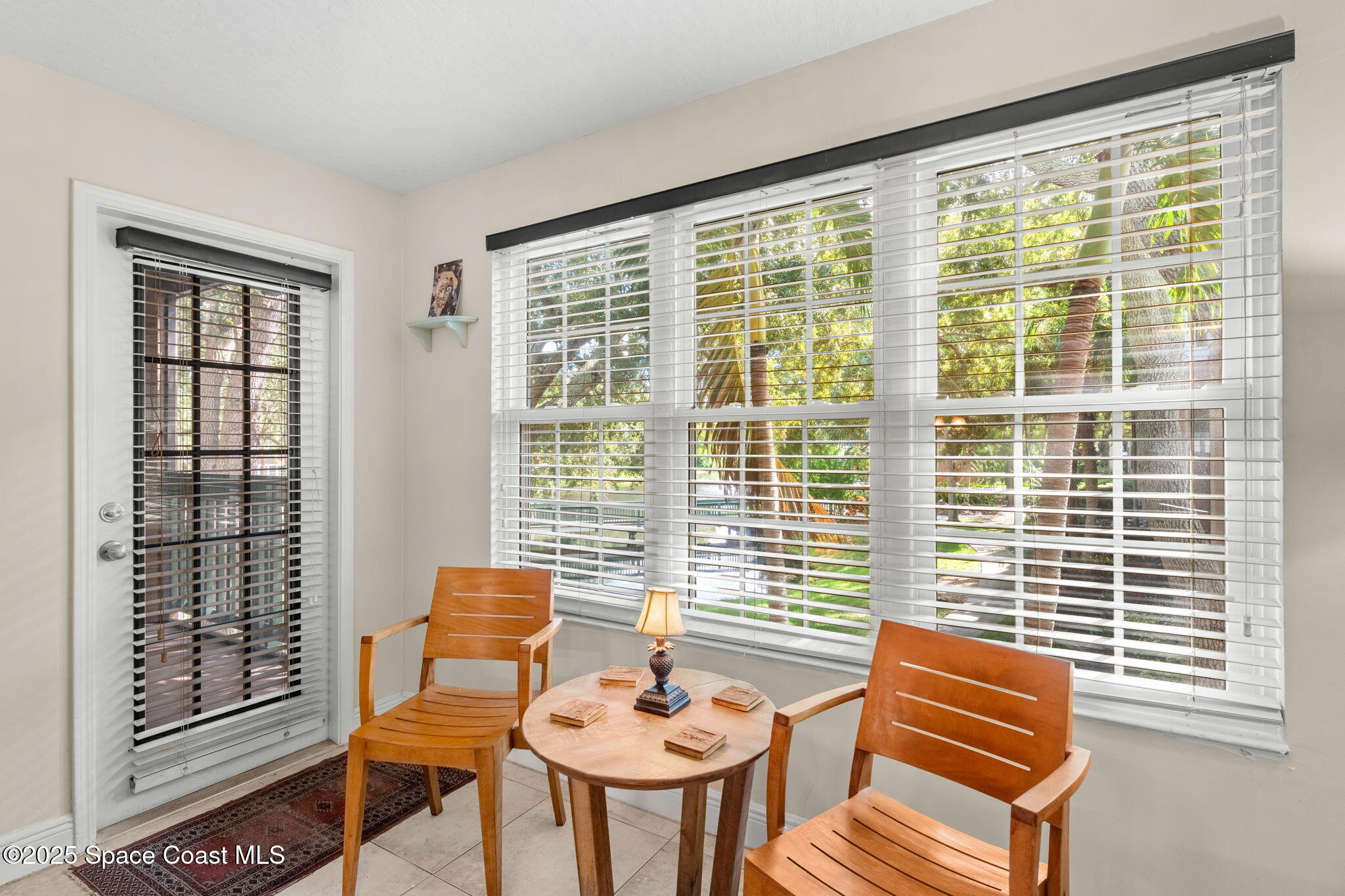 7667 North Wickham Road, Unit 514 Melbourne, FL 32940 - Photo 13 of 37 a living room with furniture and a window