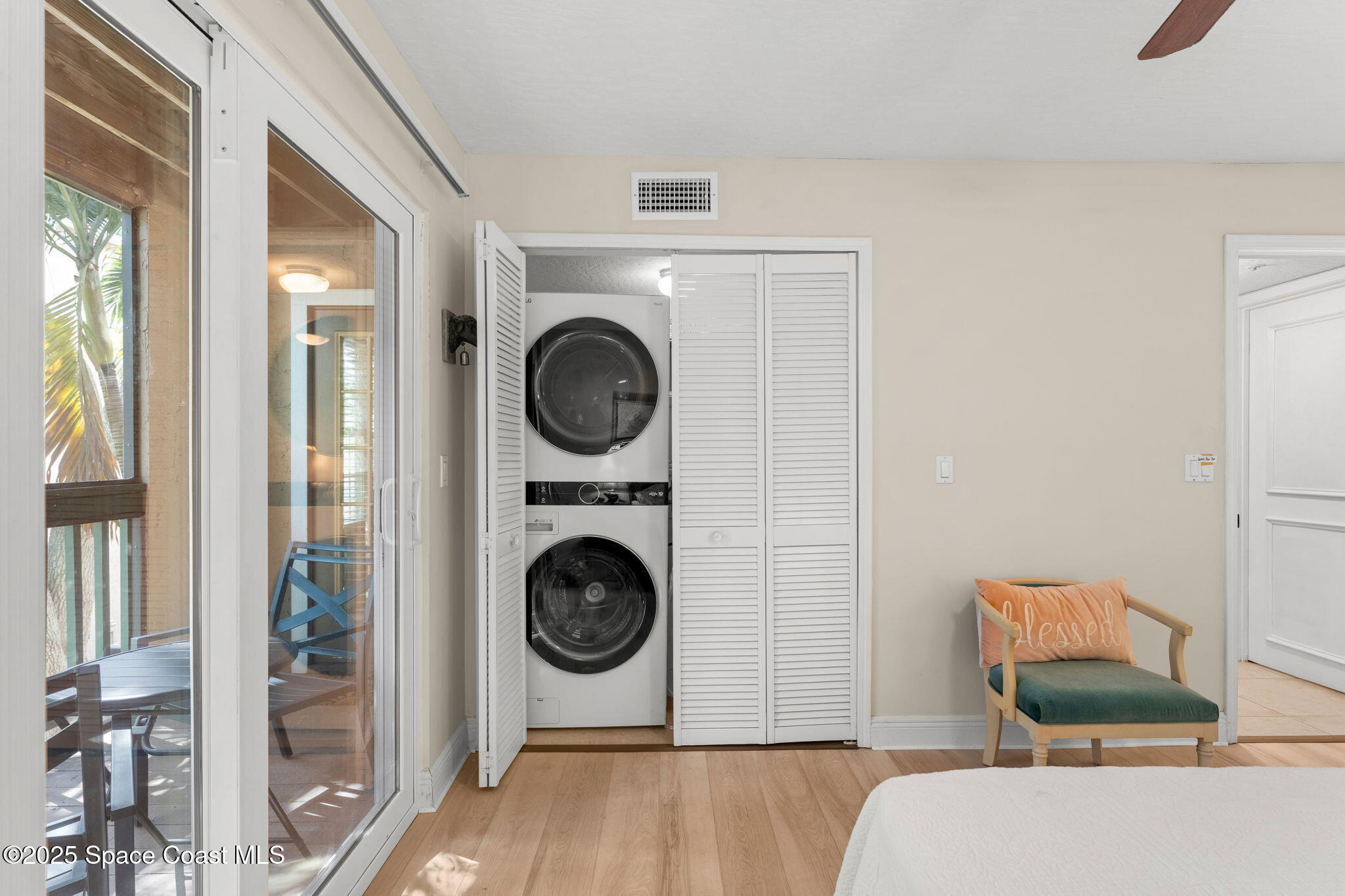 7667 North Wickham Road, Unit 514 Melbourne, FL 32940 - Photo 20 of 37 a living room with furniture and a washing machine