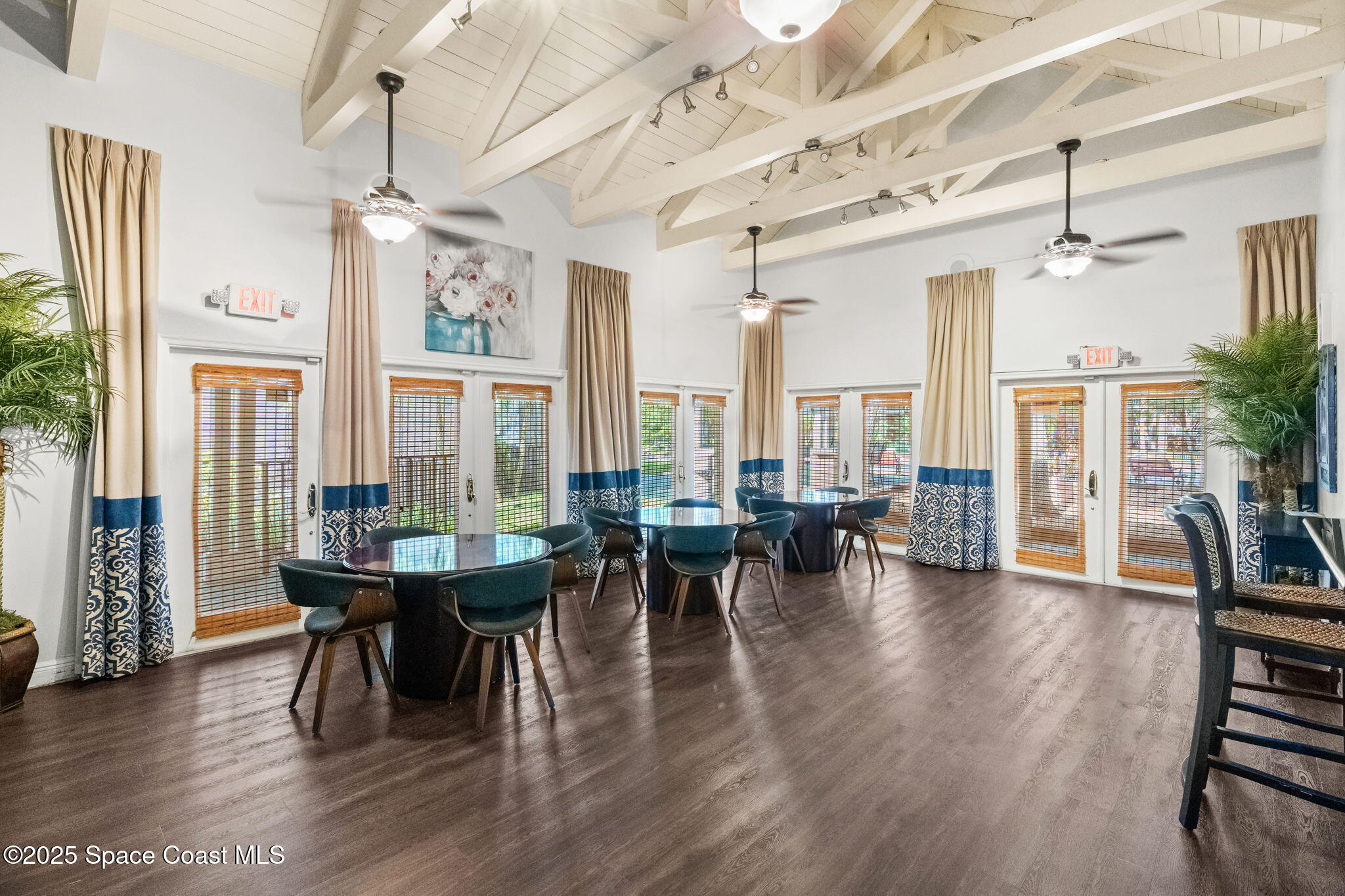 7667 North Wickham Road, Unit 514 Melbourne, FL 32940 - Photo 24 of 37 a view of a dining room with furniture and wooden floor