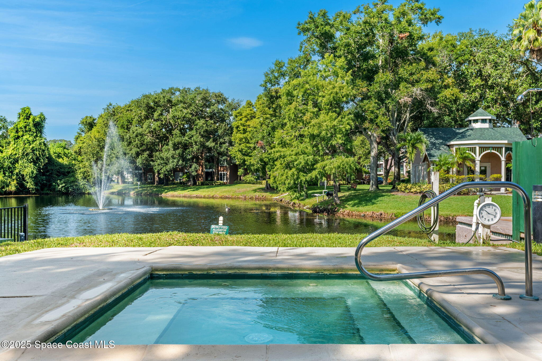 7667 North Wickham Road, Unit 514 Melbourne, FL 32940 - Photo 28 of 37 a view of a swimming pool with a lake view