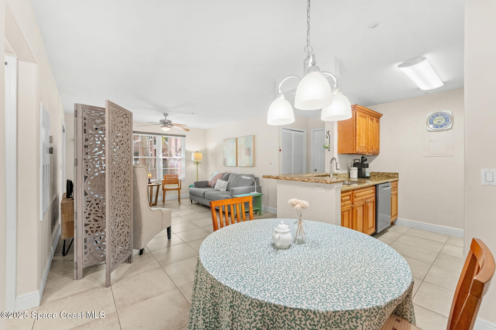 7667 North Wickham Road, Unit 514 Melbourne, FL 32940 - Photo 9 of 37 a view of kitchen with furniture and chandelier