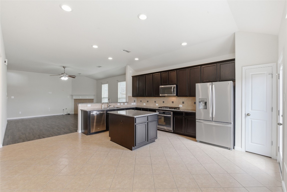 3418 Delta Drive Rosharon, TX 77583 - Photo 13 of 38 a large kitchen with a large counter top stainless steel appliances and cabinets