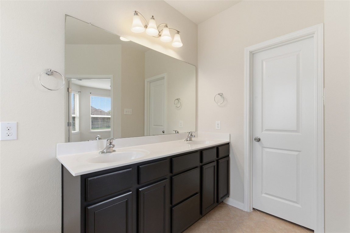 3418 Delta Drive Rosharon, TX 77583 - Photo 19 of 38 a bathroom with a sink double vanity and a mirror