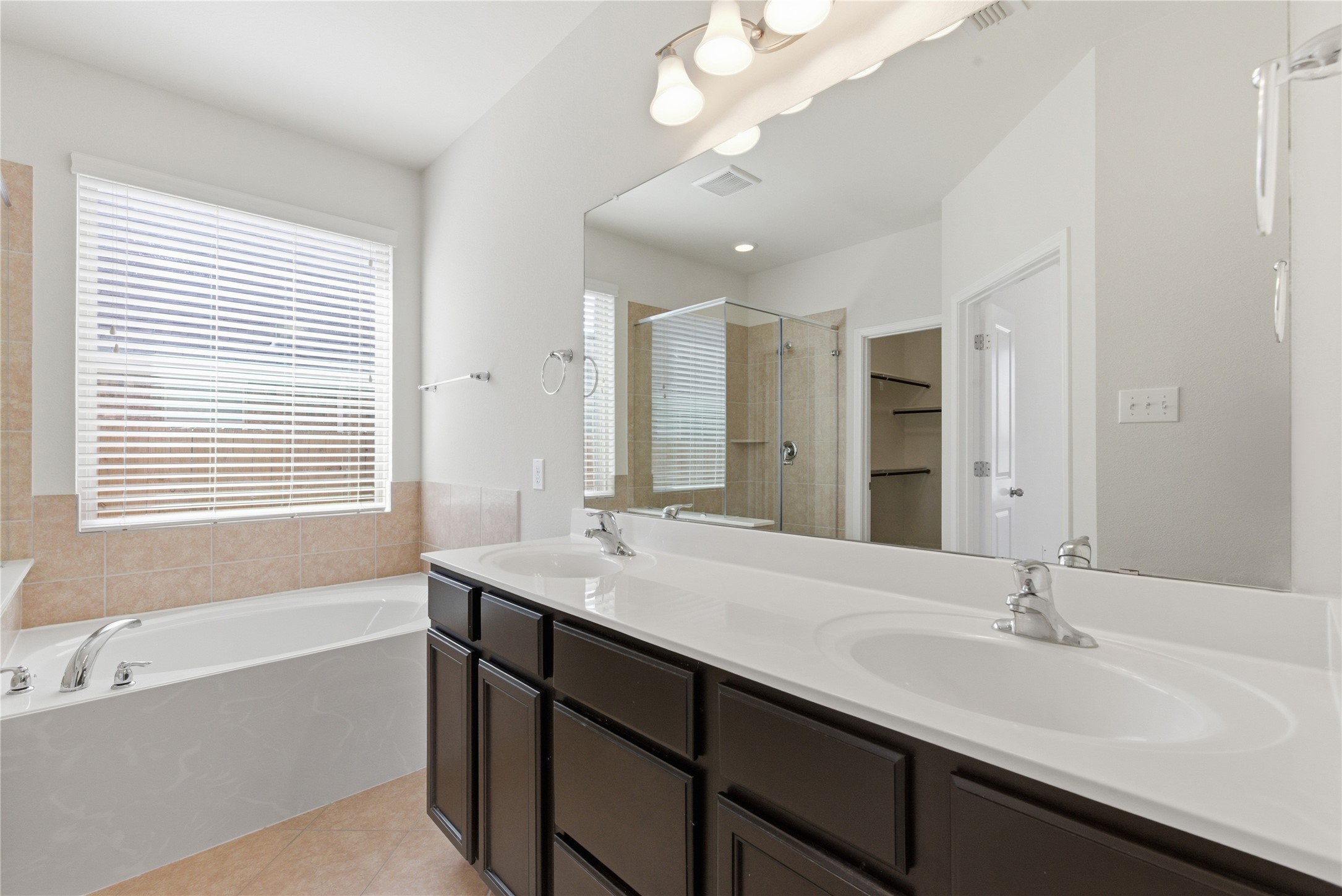 3418 Delta Drive Rosharon, TX 77583 - Photo 23 of 38 a bathroom with a sink double vanity granite tub shower and a mirror