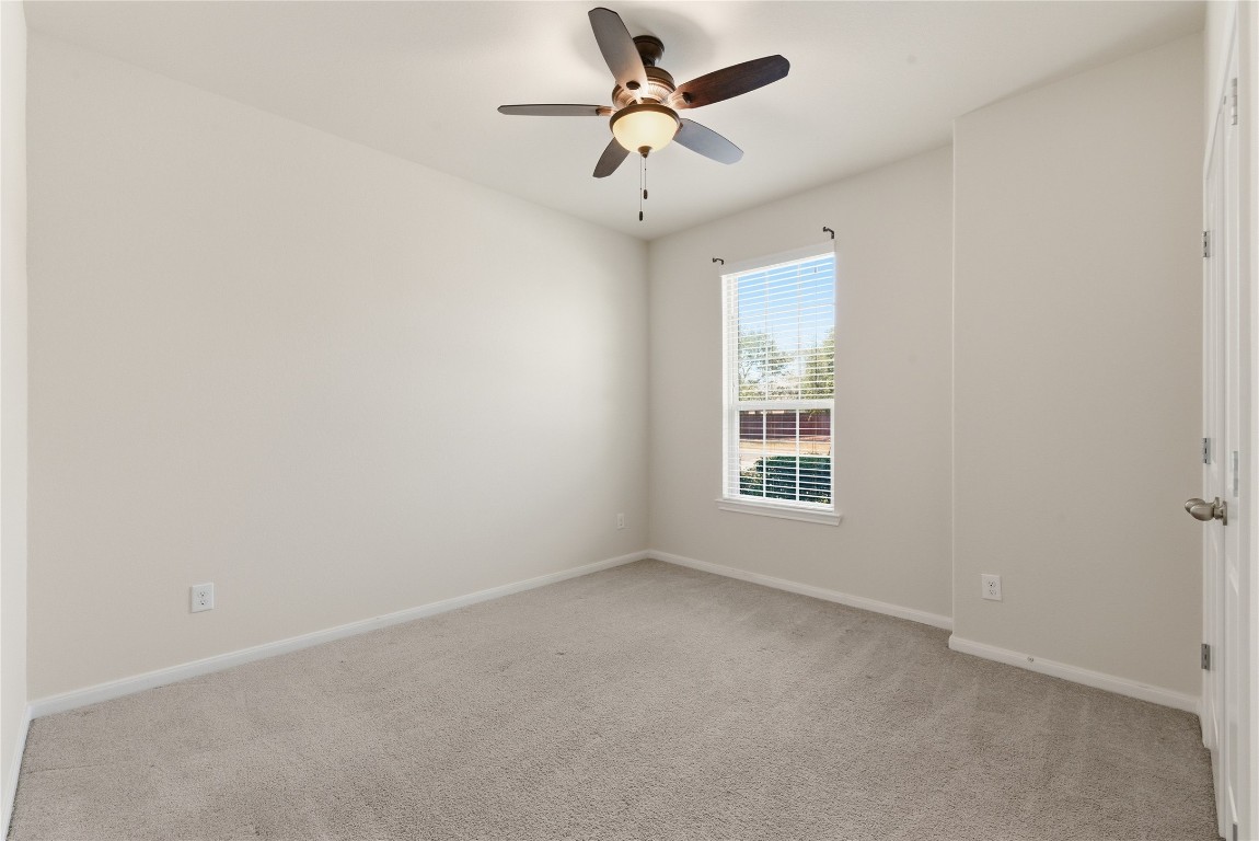 3418 Delta Drive Rosharon, TX 77583 - Photo 24 of 38 an empty room with a window and a fan