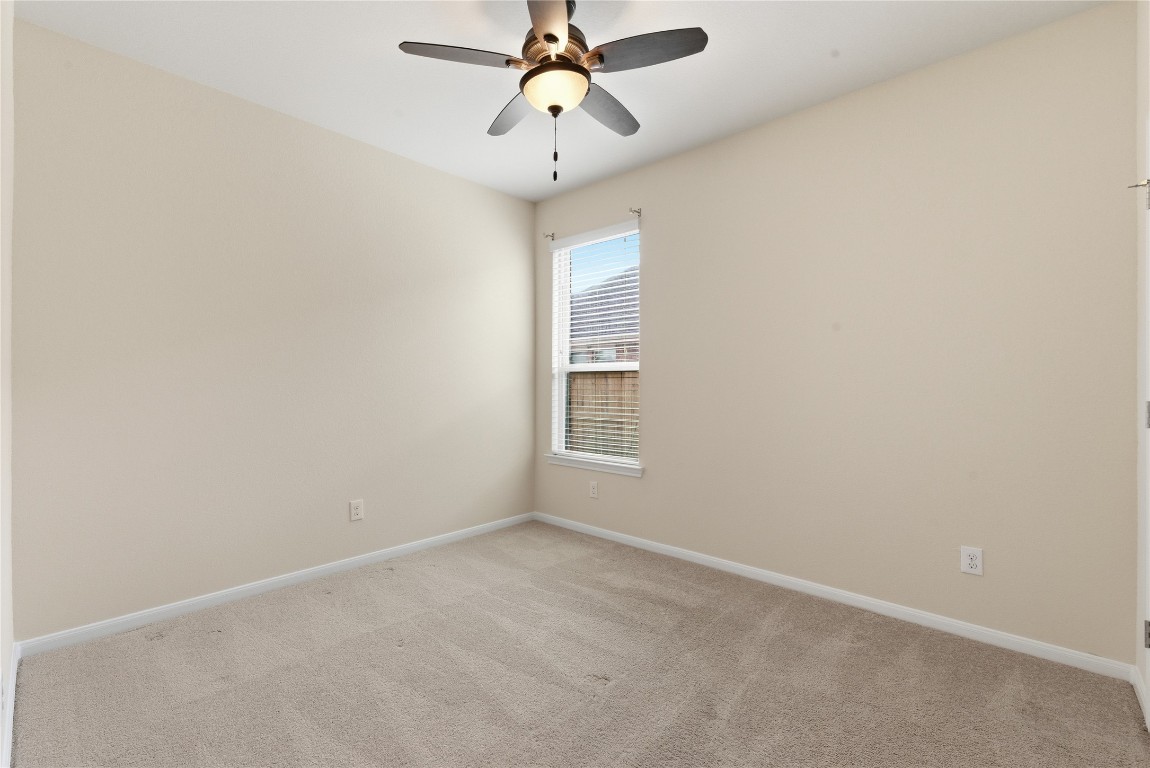 3418 Delta Drive Rosharon, TX 77583 - Photo 27 of 38 an empty room with a window and a fan