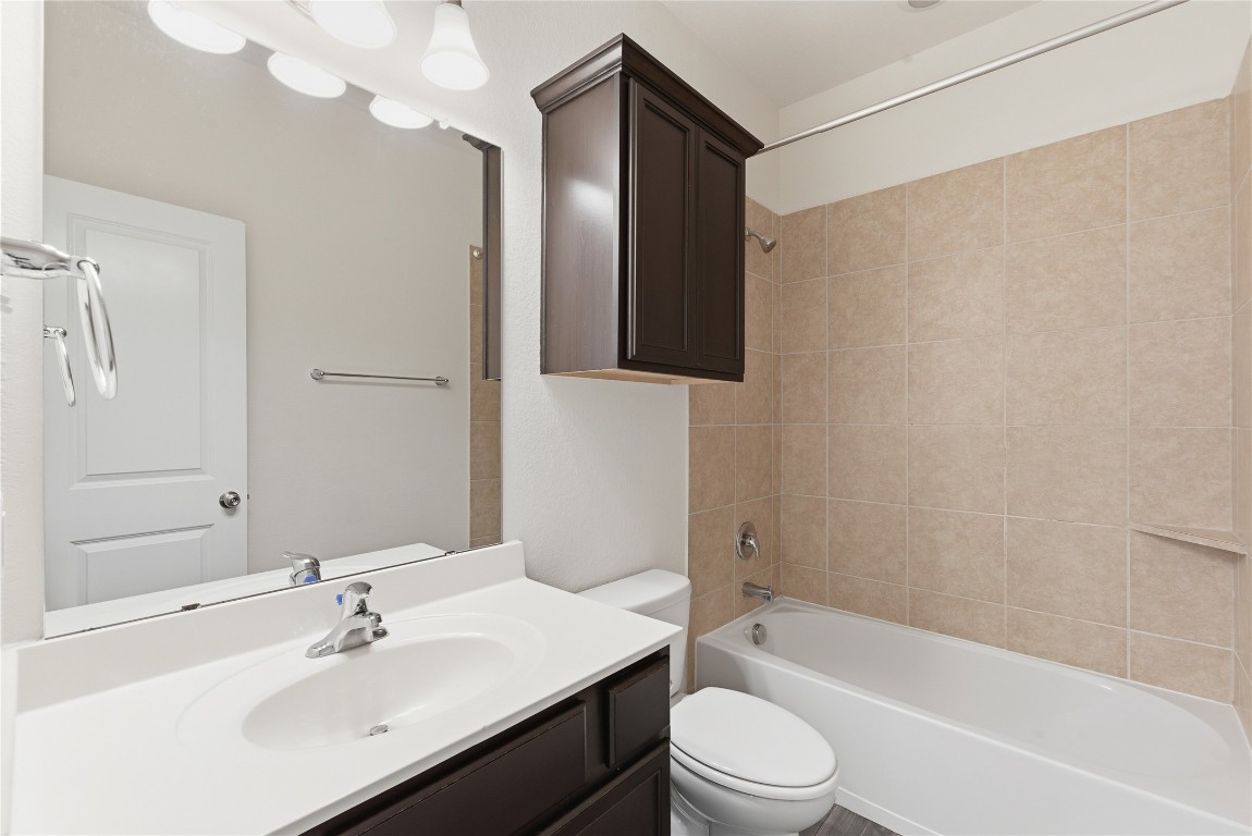 3418 Delta Drive Rosharon, TX 77583 - Photo 29 of 38 a bathroom with a bathtub shower sink vanity mirror and toilet