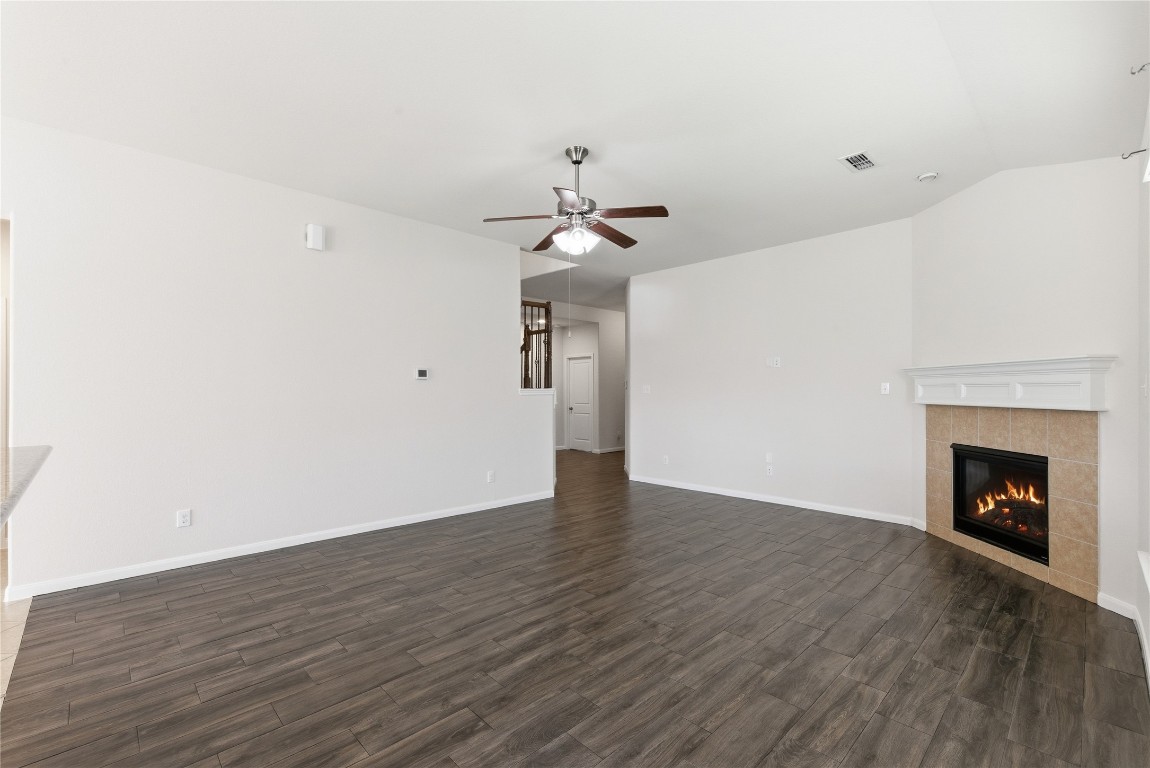 3418 Delta Drive Rosharon, TX 77583 - Photo 9 of 38 a view of an empty room with wooden floor and a fireplace
