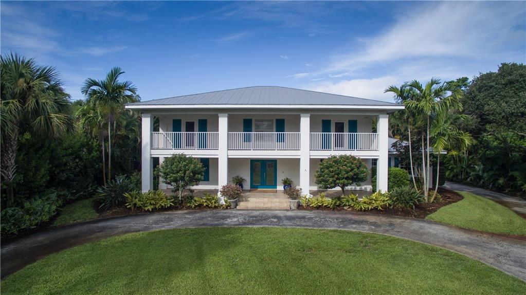 171 South Sewalls Point Road Stuart, FL 34996 - Photo 1 of 34 front view of a house with a yard