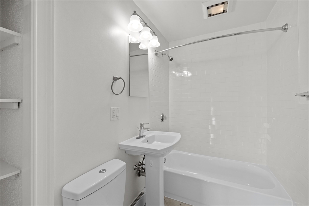 134 Summer Street, Unit 37 Malden, MA 02148 - Photo 8 of 10 a bathroom with a sink toilet and shower