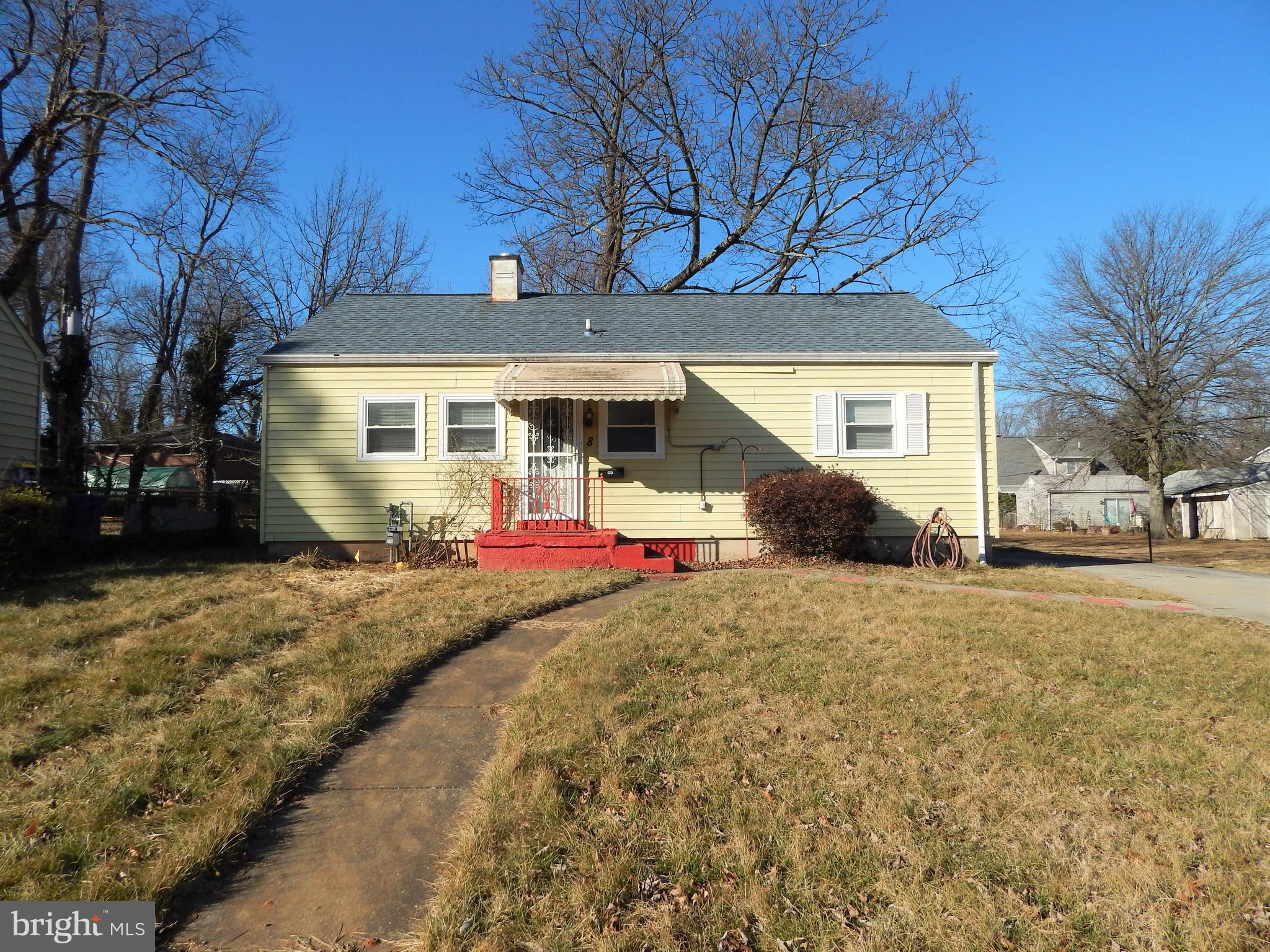 8 Greenwood Road Pikesville, MD 21208 - Photo 1 of 16 a view of a house with a yard and garage