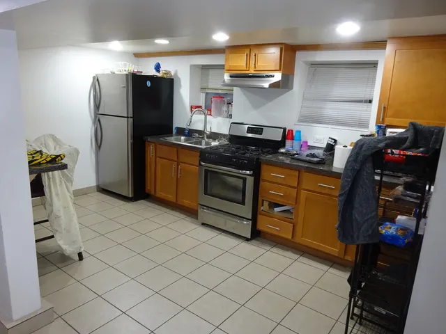 a kitchen with refrigerator and window