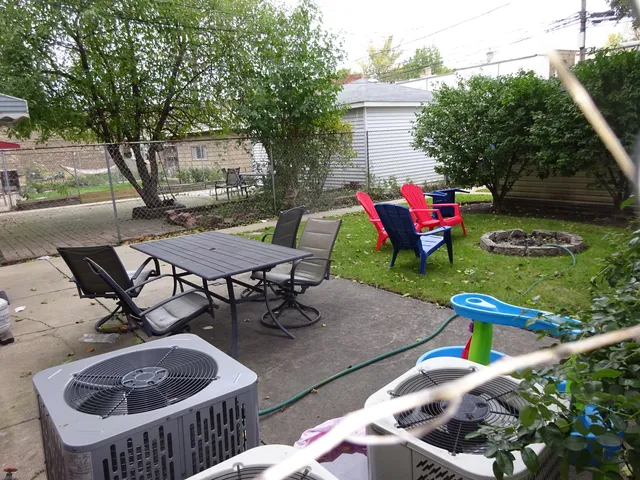 a view of a backyard with sitting area and furniture