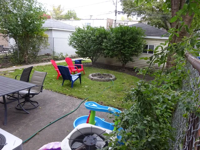 a view of backyard with sitting area and outdoor seating
