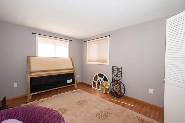 a room with a bed and a window