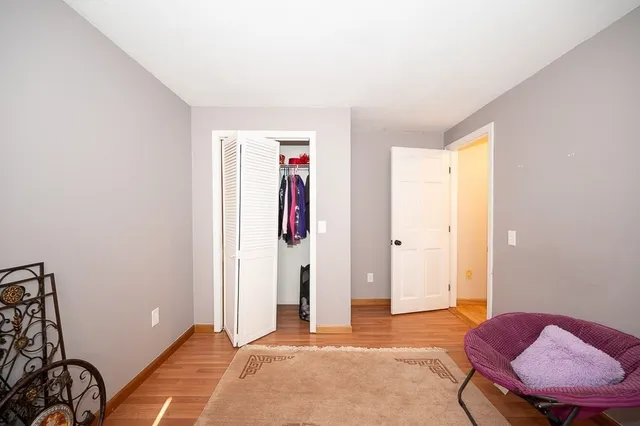 a car parked in front of white house