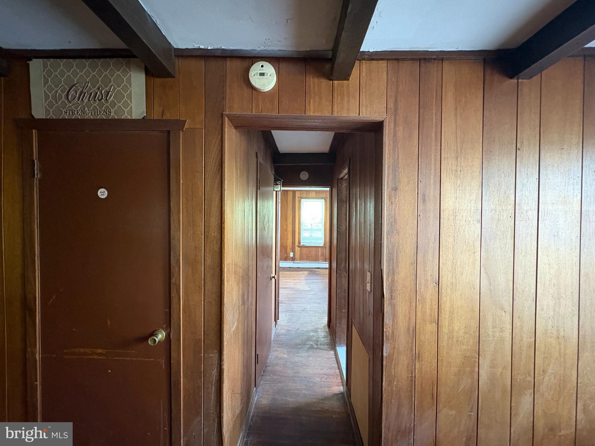 1405 Pennington Road, Unit 2A Ewing, NJ 08618 - Photo 7 of 12 a view of a hallway with wooden shelves