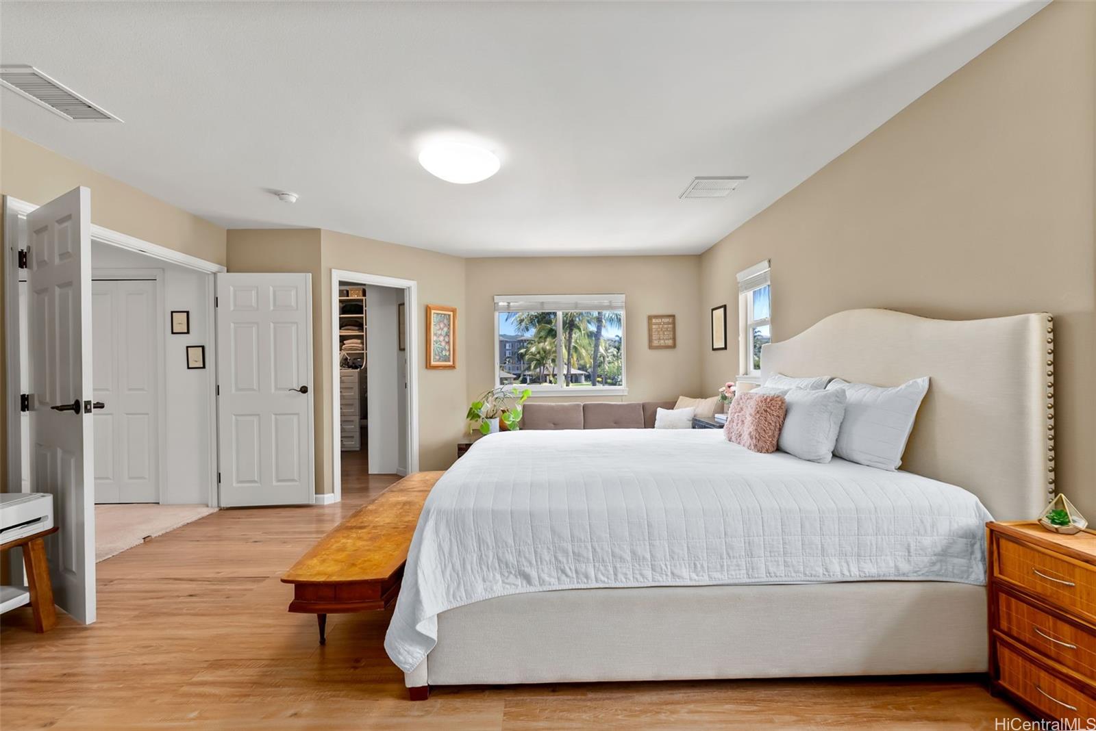 520 Lunalilo Home Road, Unit 310 Honolulu, HI 96825 - Photo 13 of 23 Another view of the primary suite with double-door entry and walk-in closet.