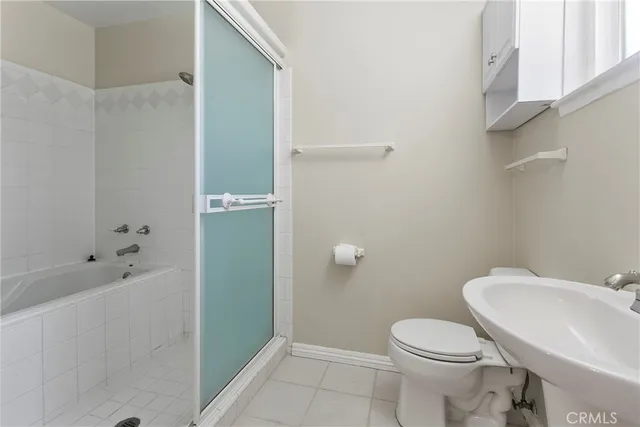 a bathroom with a sink and toilet