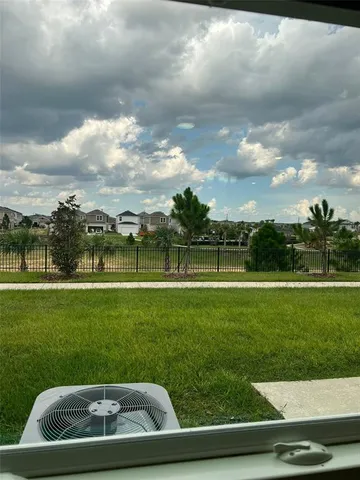 a view of a golf course with a lake