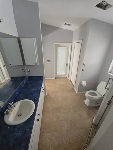 a bathroom with a sink and mirror