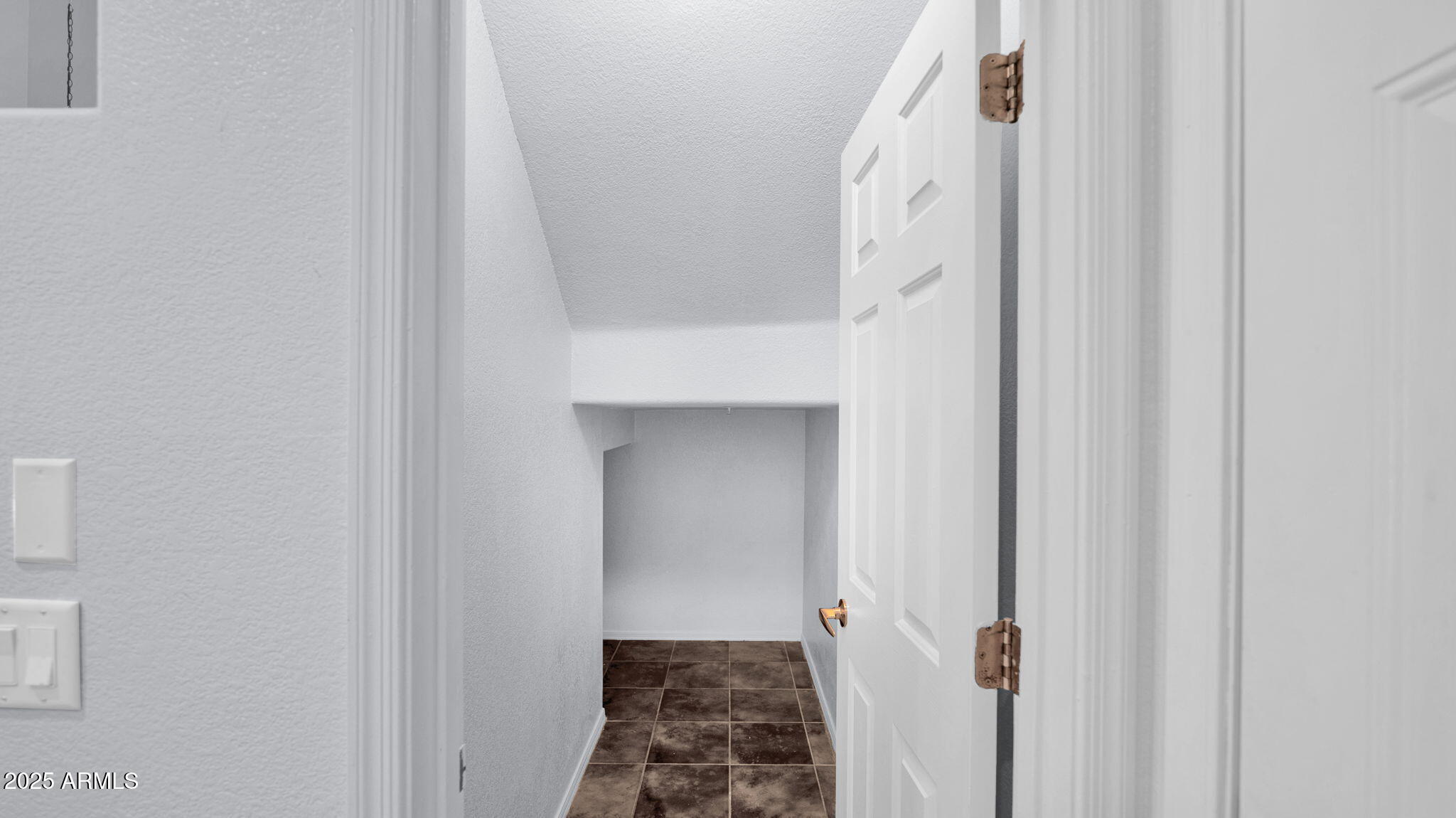 1702 East Bell Road, Unit 113 Phoenix, AZ 85022 - Photo 11 of 32 a view of a hallway with white walls and stairs