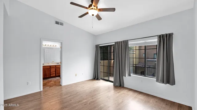 a spacious bathroom with a sink mirror and a bathtub