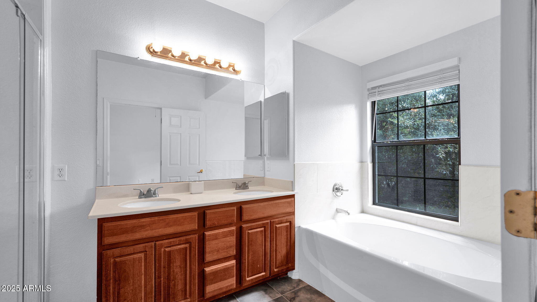 1702 East Bell Road, Unit 113 Phoenix, AZ 85022 - Photo 18 of 32 a spacious bathroom with a sink mirror and a bathtub