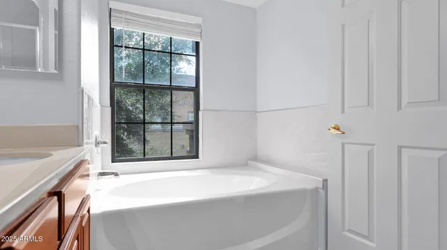 a bathroom with a sink and a shower