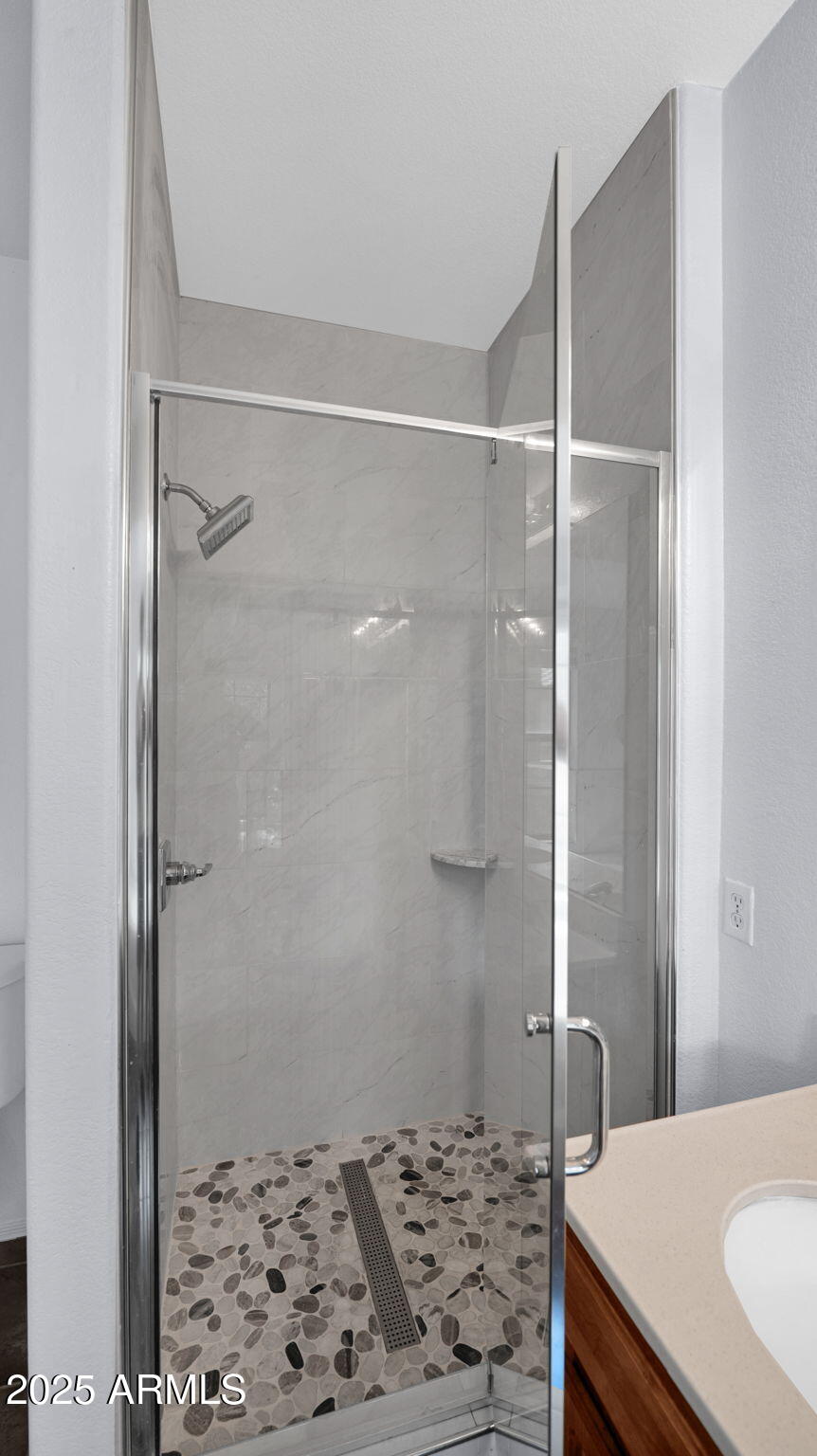 1702 East Bell Road, Unit 113 Phoenix, AZ 85022 - Photo 20 of 32 a bathroom with a sink and a shower