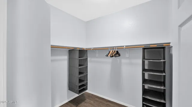 a view of hallway with wooden floor