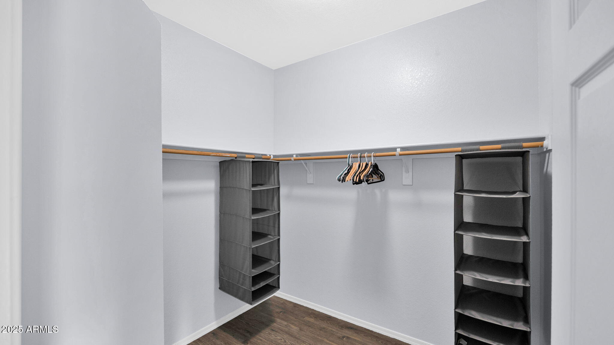 1702 East Bell Road, Unit 113 Phoenix, AZ 85022 - Photo 21 of 32 a view of walk in closet with empty racks