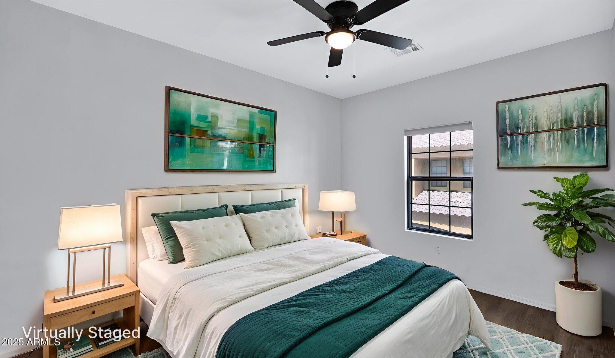 1702 East Bell Road, Unit 113 Phoenix, AZ 85022 - Photo 23 of 32 a bedroom with a large bed and a window