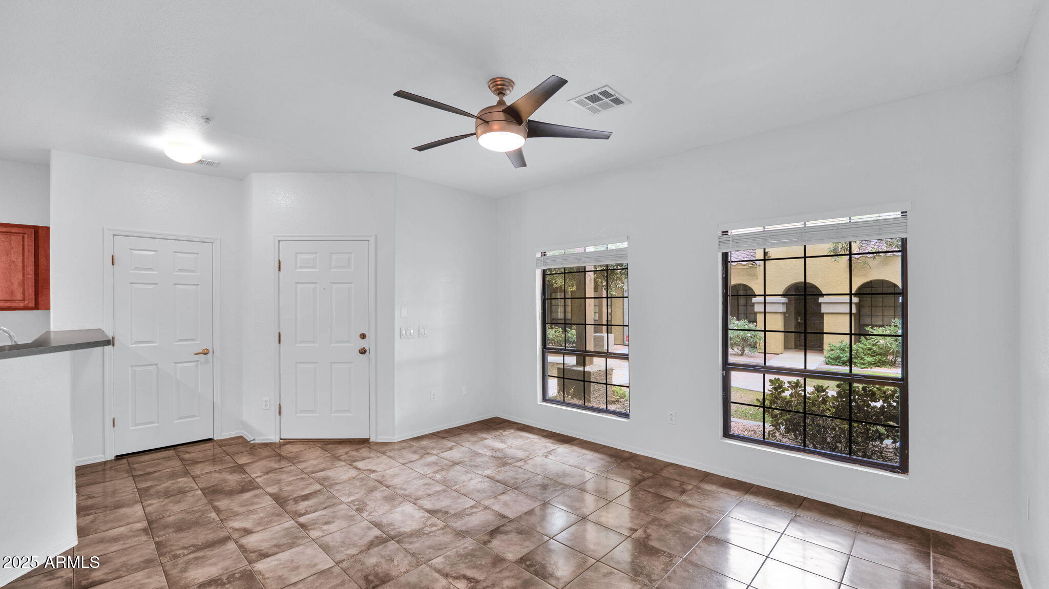 1702 East Bell Road, Unit 113 Phoenix, AZ 85022 - Photo 5 of 32 a view of a livingroom with a & window