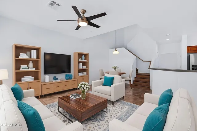 a living room with furniture and a flat screen tv