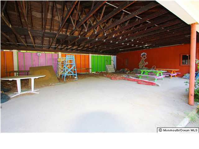 0 Fort Plains Road, Unit 131 175 Howell, NJ 07731 - Photo 14 of 25 a garage with table and chairs