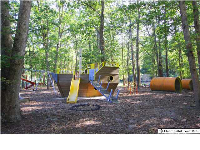 0 Fort Plains Road, Unit 131 175 Howell, NJ 07731 - Photo 21 of 25 a backyard of a house with table and chairs