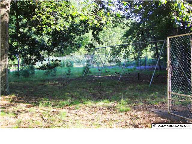 0 Fort Plains Road, Unit 131 175 Howell, NJ 07731 - Photo 23 of 25 a backyard of a house with lots of green space