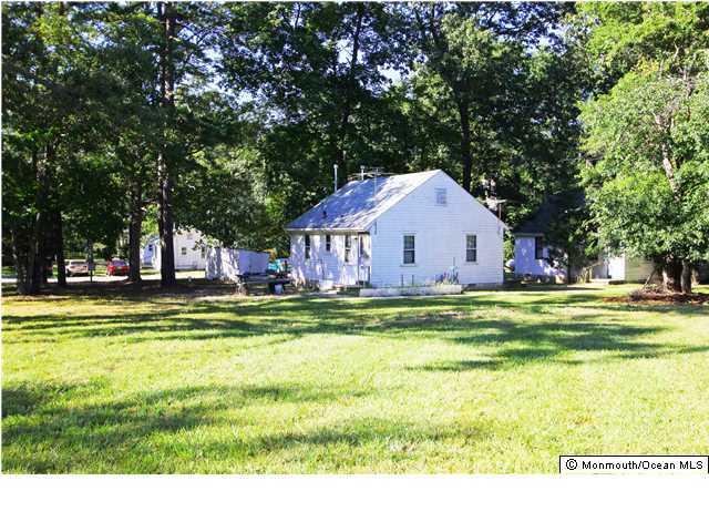 0 Fort Plains Road, Unit 131 175 Howell, NJ 07731 - Photo 8 of 25 a view of swimming pool with lawn chairs and large trees