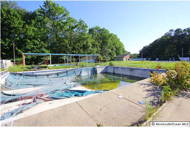 0 Fort Plains Road, Unit 131 175 Howell, NJ 07731 - Photo 10 of 25 a view of a backyard with swimming pool