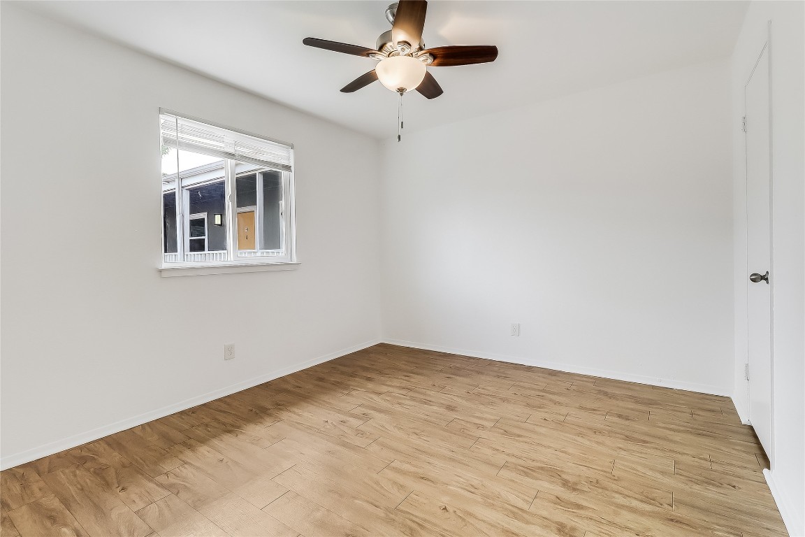 2401 Manor Road, Unit 210 Austin, TX 78722 - Photo 14 of 20 a view of an empty room with a window