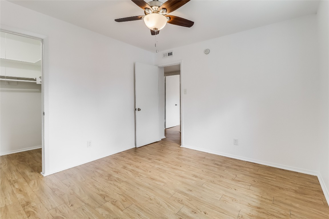 2401 Manor Road, Unit 210 Austin, TX 78722 - Photo 15 of 20 a view of an empty room with wooden floor