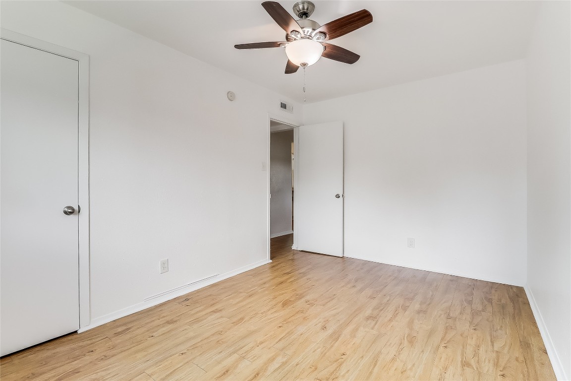 2401 Manor Road, Unit 210 Austin, TX 78722 - Photo 16 of 20 a view of empty room with wooden floor