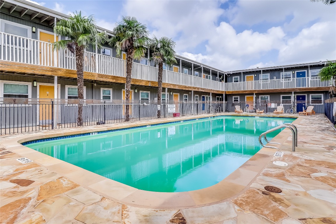 2401 Manor Road, Unit 210 Austin, TX 78722 - Photo 18 of 20 a view of a house with a swimming pool
