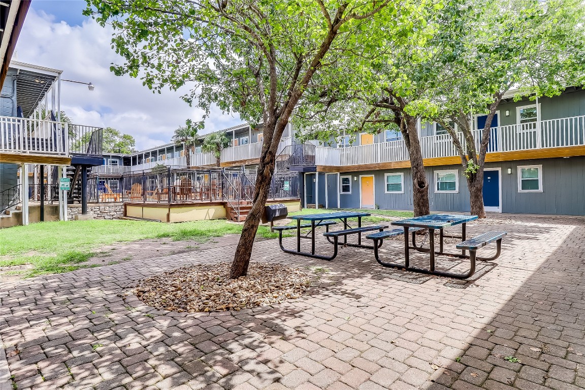 2401 Manor Road, Unit 210 Austin, TX 78722 - Photo 20 of 20 a front view of a house with garden and sitting area