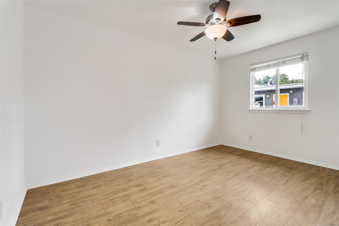 2401 Manor Road, Unit 210 Austin, TX 78722 - Photo 3 of 20 an empty room with windows and fan