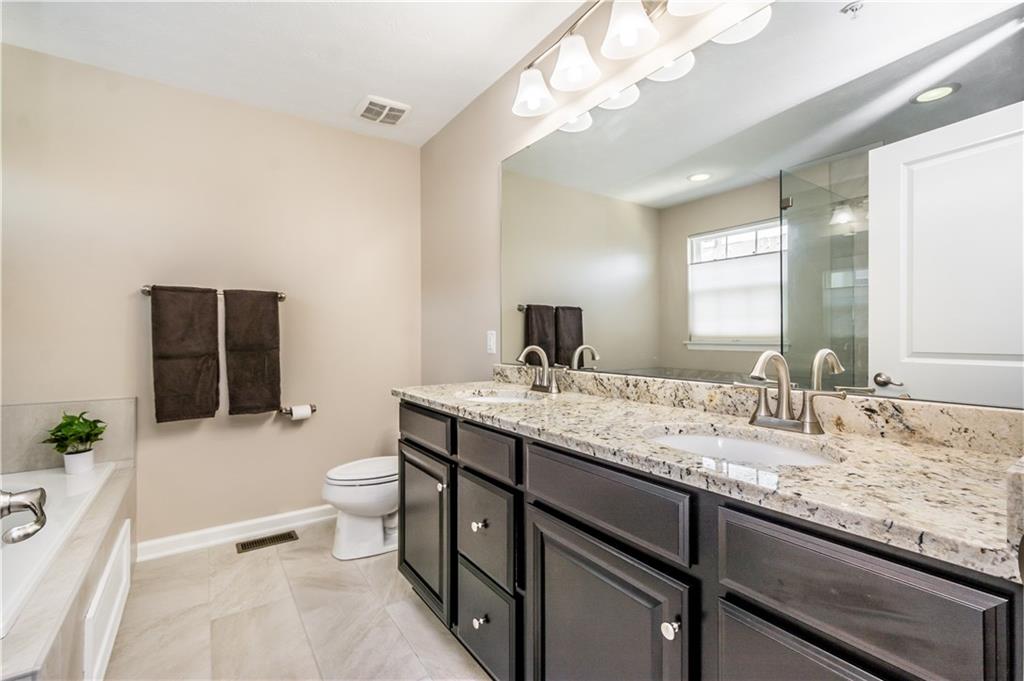 609 Rosecliff Road Wexford, PA 15090 - Photo 21 of 25 Completing renovated master bathroom! New double vanity with thick, granite counters & well-lit, expansive mirror.