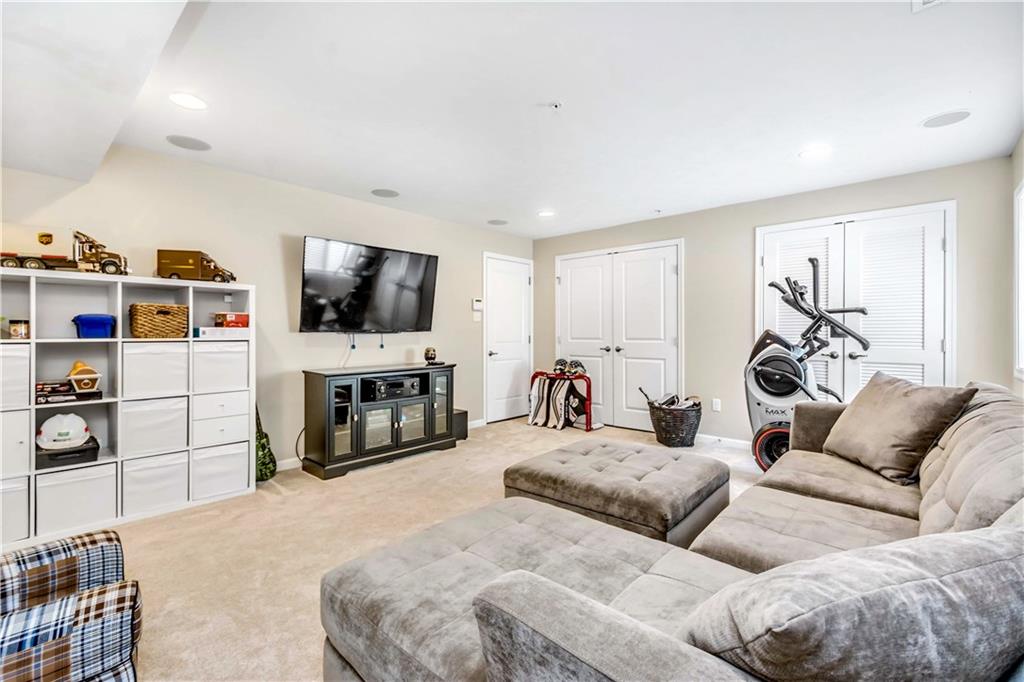 609 Rosecliff Road Wexford, PA 15090 - Photo 25 of 25 Notice the circles on the ceiling?? This room is wired with surround sound that runs up into the kitchen...components are included in the sale! Great for movies & sports. (2 more storage closets!)
